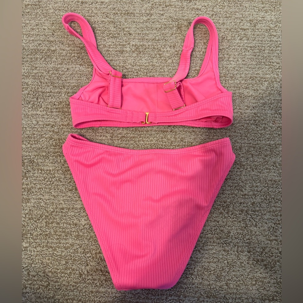 This is a bright pink swimsuits. Never been worn